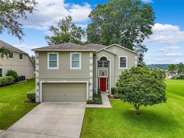 view of front of home with central AC, a front lawn, concrete driveway, and stucco siding