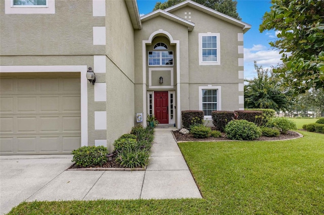 view of front facade featuring a front yard and stucco siding