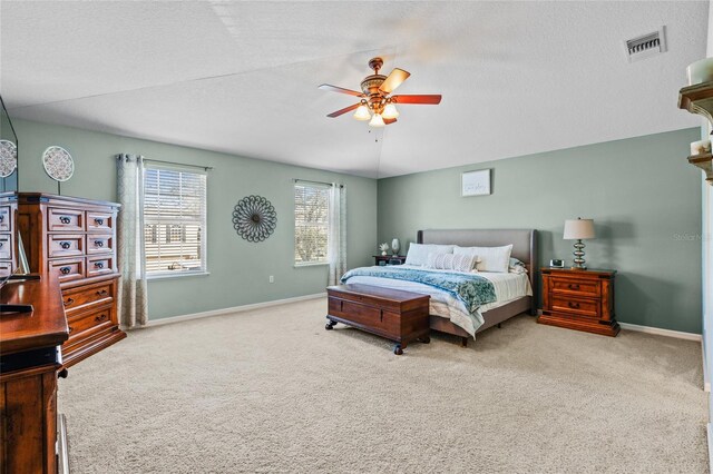 bedroom with carpet floors, visible vents, and baseboards