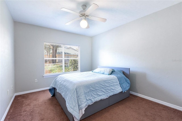 bedroom featuring ceiling fan, carpet floors, and baseboards