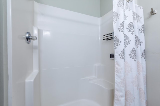 bathroom featuring curtained shower