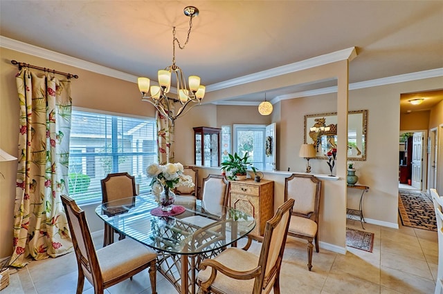 dining area with light tile patterned floors, ornamental molding, a chandelier, and baseboards