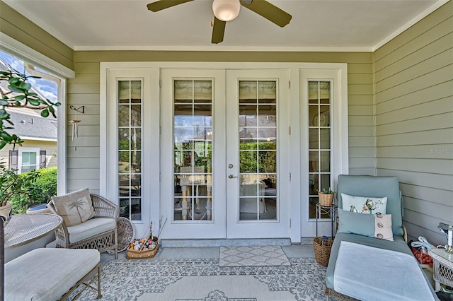 entrance to property with french doors and a ceiling fan