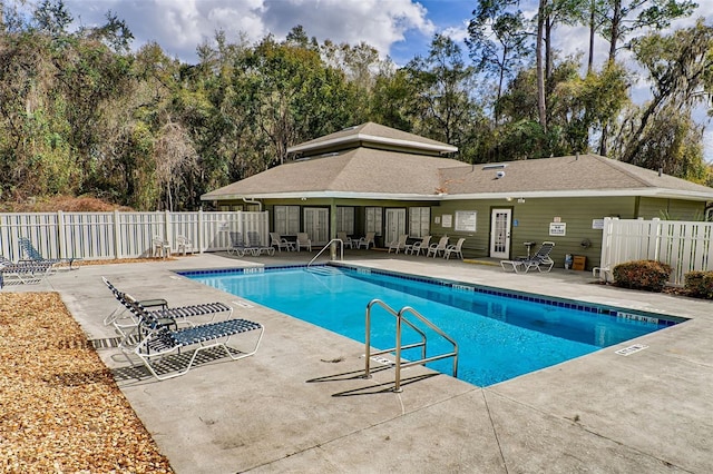 pool featuring a patio and fence