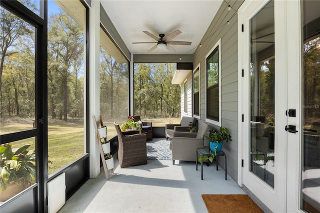 sunroom / solarium with ceiling fan