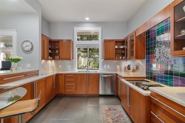 kitchen with open shelves, stainless steel dishwasher, brown cabinetry, and a sink