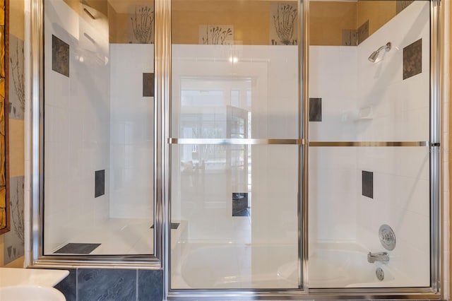 full bath with shower / bath combination with glass door