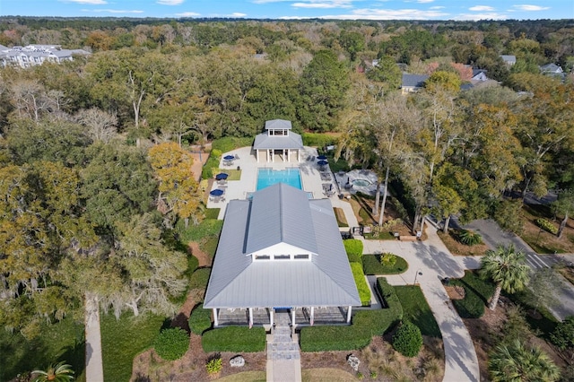 drone / aerial view featuring a forest view