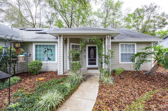 view of front of house with a shingled roof