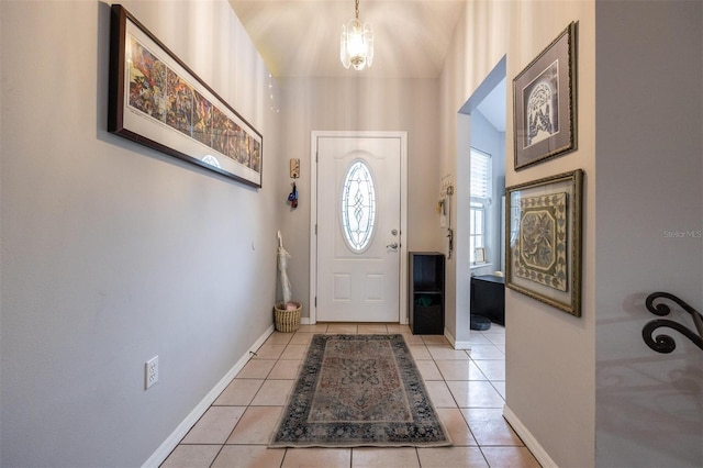 entryway featuring light tile patterned floors and baseboards