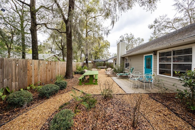 view of yard featuring a fenced backyard and a patio area