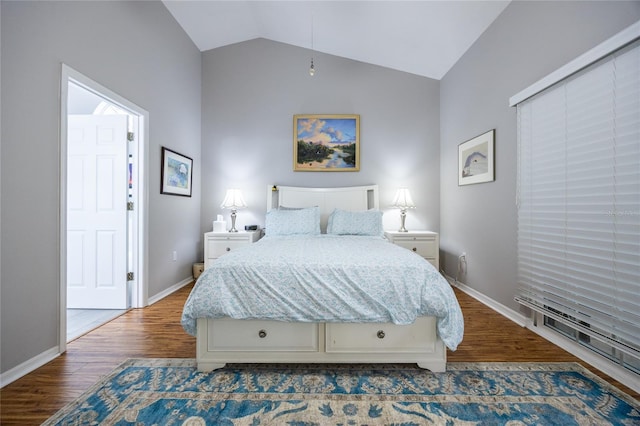 bedroom featuring baseboards, lofted ceiling, and dark wood finished floors