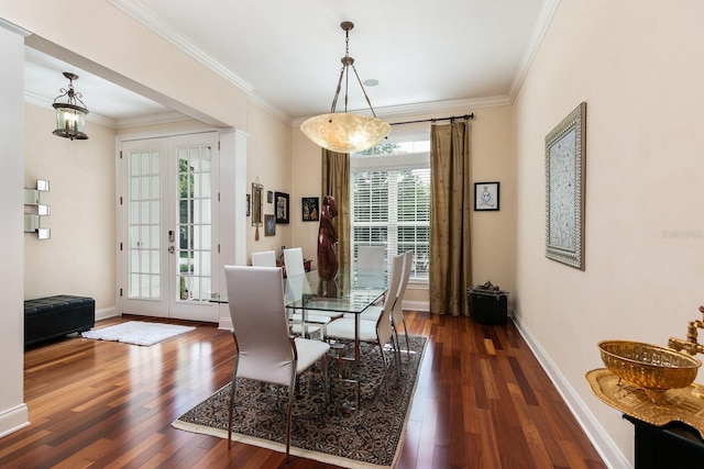 dining space with french doors, ornamental molding, dark wood finished floors, and baseboards