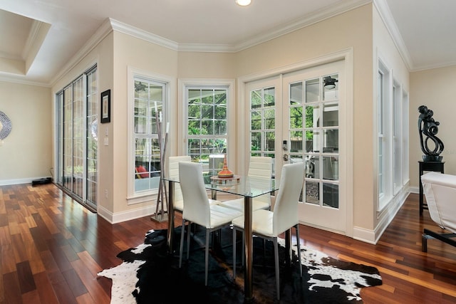 dining area with dark wood-style floors, french doors, baseboards, and crown molding