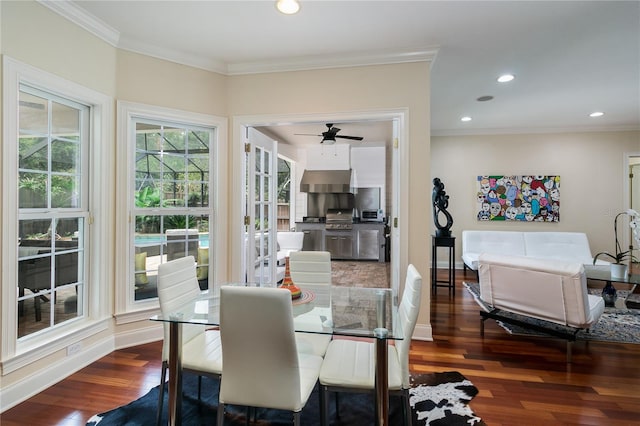 dining room with recessed lighting, crown molding, baseboards, and wood finished floors