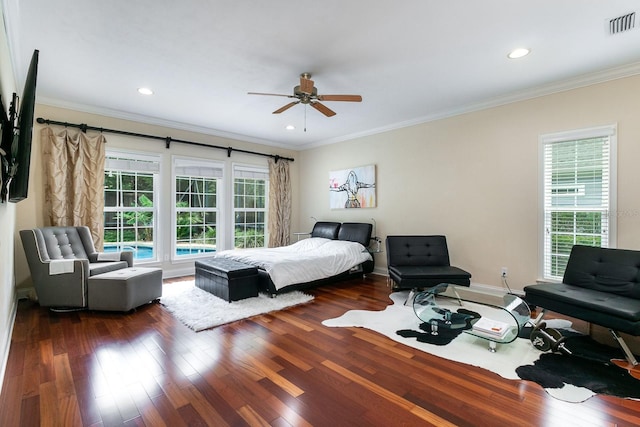 bedroom with visible vents, dark wood finished floors, crown molding, and recessed lighting