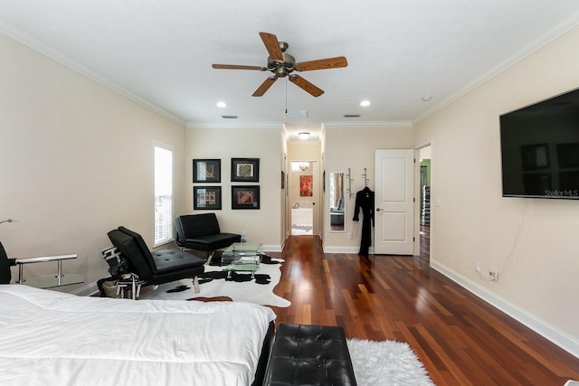 bedroom with crown molding, baseboards, and wood finished floors