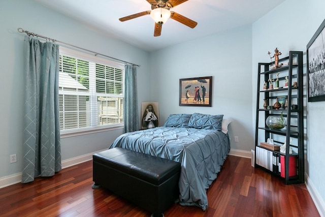 bedroom with ceiling fan, wood finished floors, and baseboards