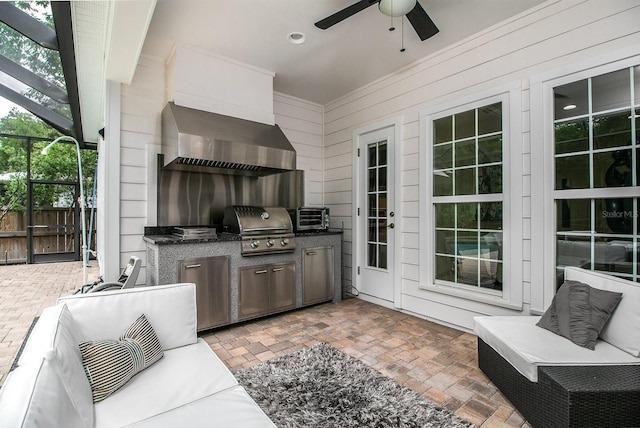 view of patio with glass enclosure, ceiling fan, an outdoor hangout area, and area for grilling