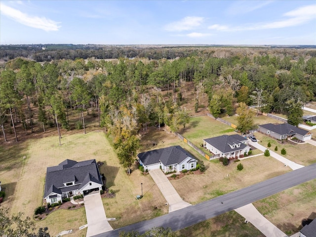 aerial view featuring a wooded view