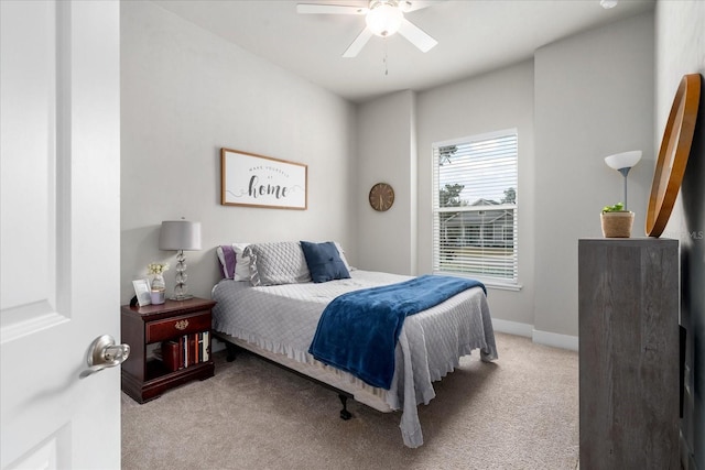 bedroom with carpet floors, a ceiling fan, and baseboards
