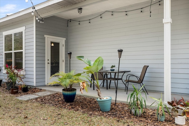 property entrance with a patio area