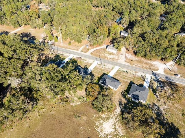 bird's eye view featuring a forest view