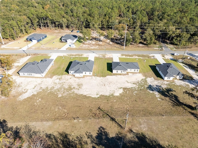 drone / aerial view with a view of trees