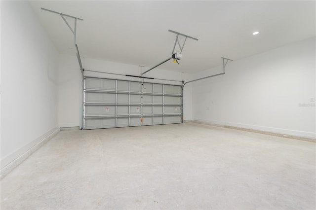 garage with a garage door opener and baseboards