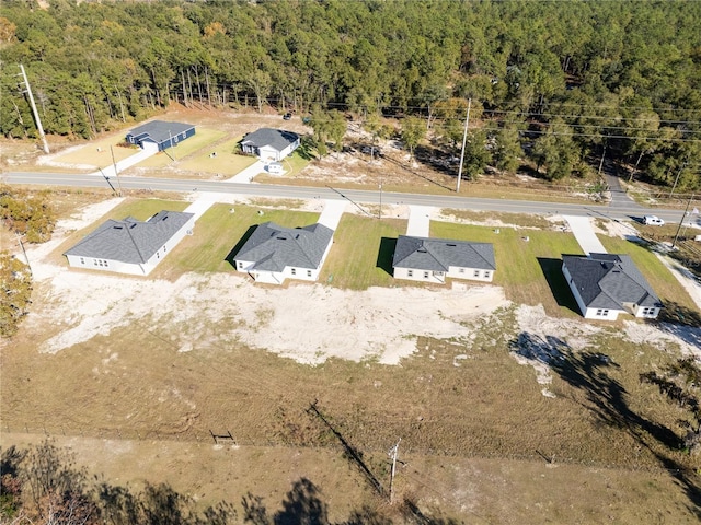 bird's eye view featuring a forest view