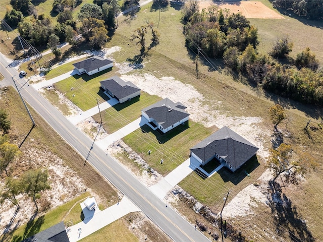 birds eye view of property featuring a rural view