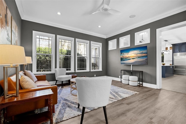 living area with ceiling fan, recessed lighting, wood finished floors, baseboards, and ornamental molding