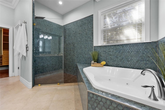 full bath featuring a walk in shower, a whirlpool tub, tile patterned flooring, and lofted ceiling