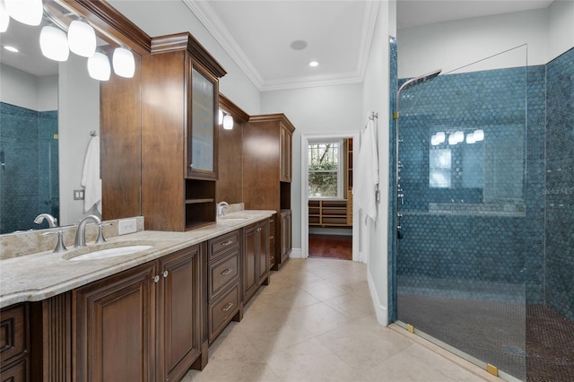 full bathroom with crown molding, double vanity, a sink, tiled shower, and tile patterned floors