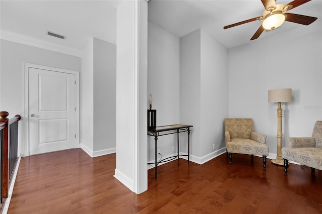 unfurnished room featuring visible vents, ceiling fan, baseboards, and wood finished floors