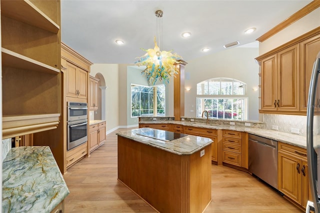 kitchen featuring open shelves, light wood-type flooring, appliances with stainless steel finishes, a peninsula, and a sink