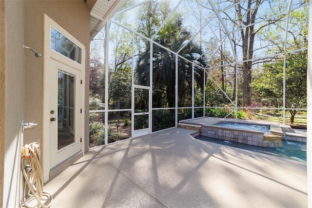 unfurnished sunroom featuring a jacuzzi