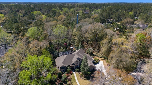 bird's eye view featuring a wooded view