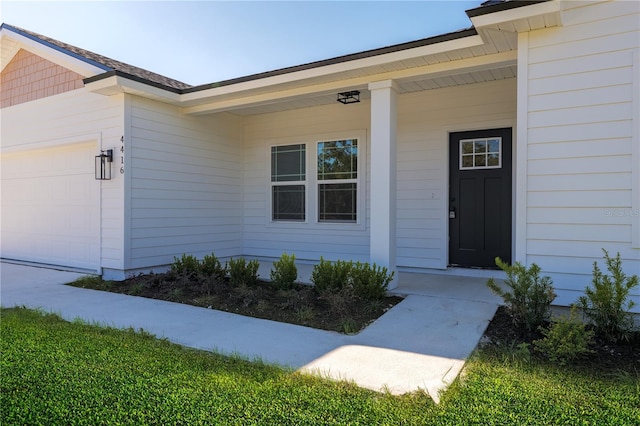 property entrance with a garage