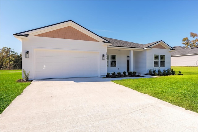 ranch-style home with a garage, concrete driveway, and a front lawn