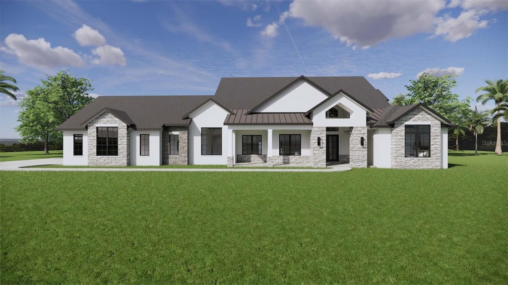 view of front of home with a standing seam roof, a front yard, stone siding, and metal roof