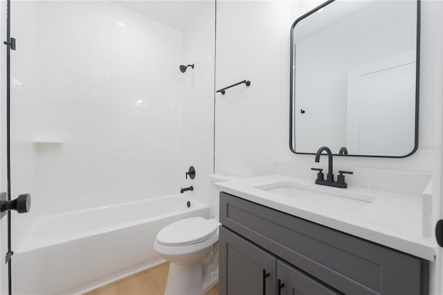 bathroom with shower / bathtub combination, vanity, and toilet