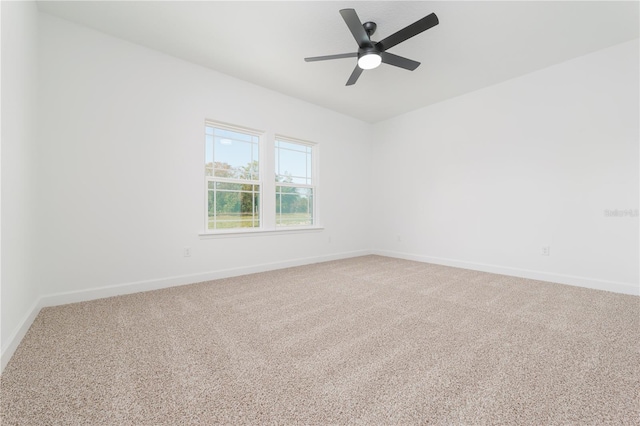 unfurnished room featuring ceiling fan, baseboards, and carpet flooring