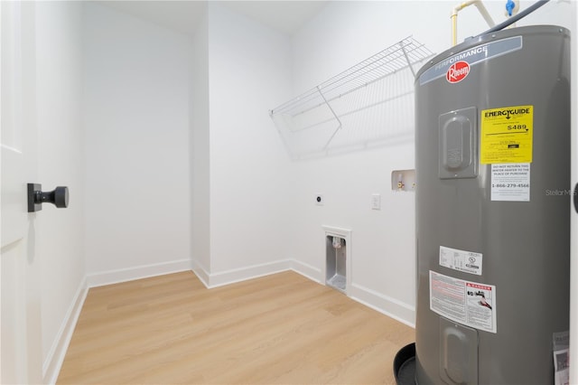 laundry area with light wood finished floors, hookup for a washing machine, electric water heater, laundry area, and baseboards