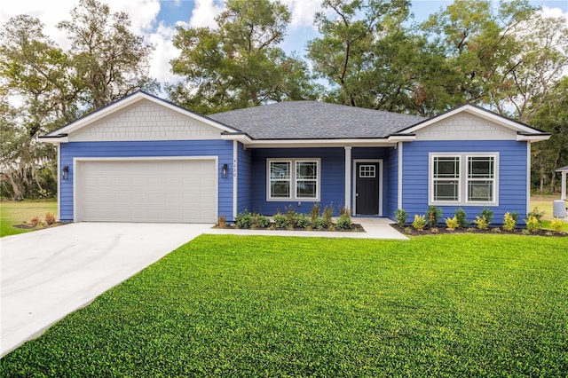 single story home featuring a garage, driveway, a shingled roof, and a front yard