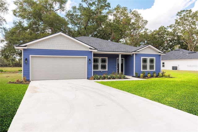 single story home with a garage, central AC, a shingled roof, driveway, and a front lawn