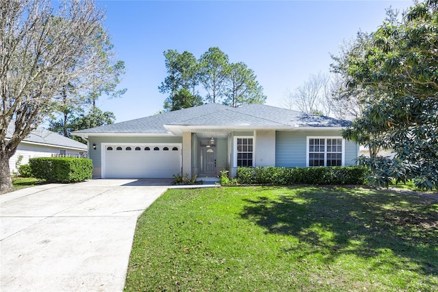 single story home with driveway, an attached garage, and a front lawn