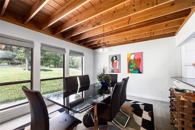 dining space with carpet, wood ceiling, beamed ceiling, and baseboards