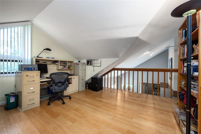 office area featuring lofted ceiling and wood finished floors