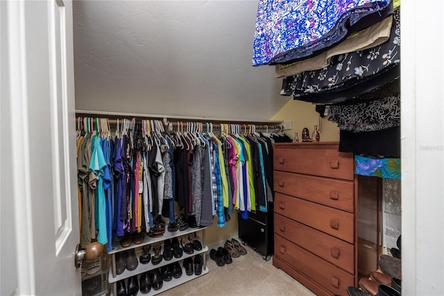 walk in closet featuring carpet floors